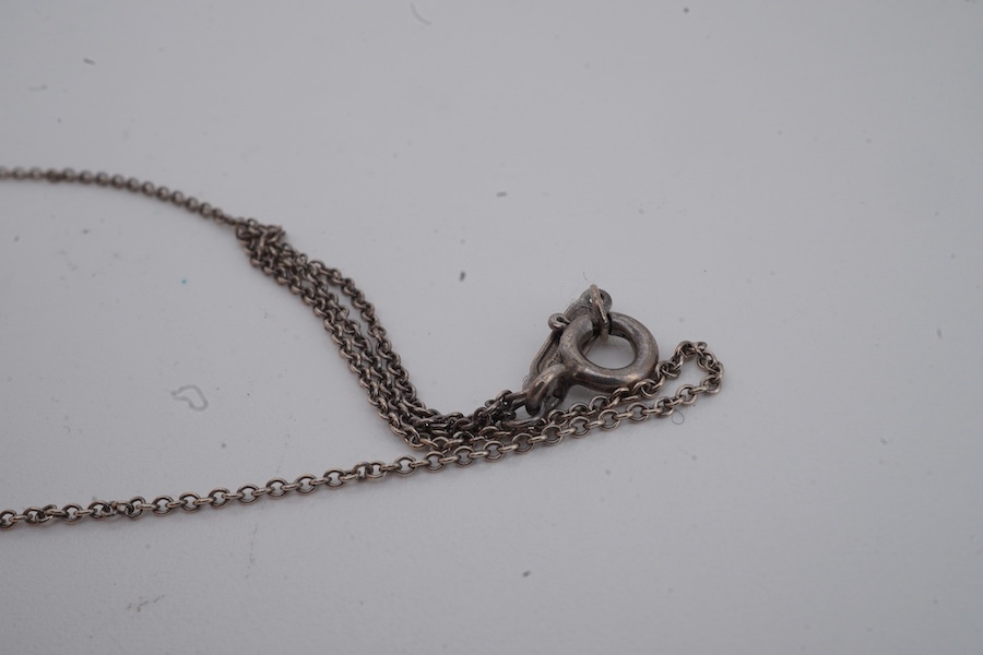 Tiffany & Co., an '1837 Interlocking Circles' pendant necklace, the pendant composed of a pair of interlocking silver and gold rings, to a silver chain, necklace length 47cm, signed T&Co, inscribed 1837, stamped 925 and